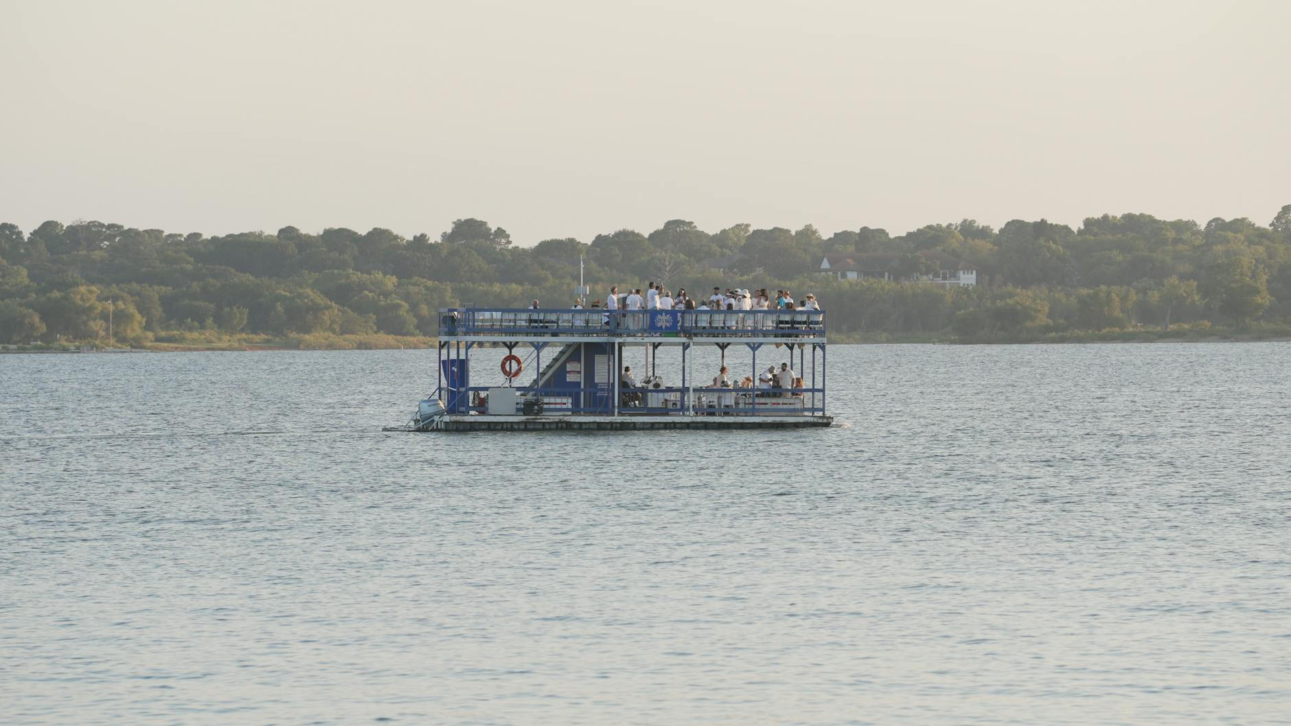 Boat on lake representing Lake Texoma day trip from Frisco TX