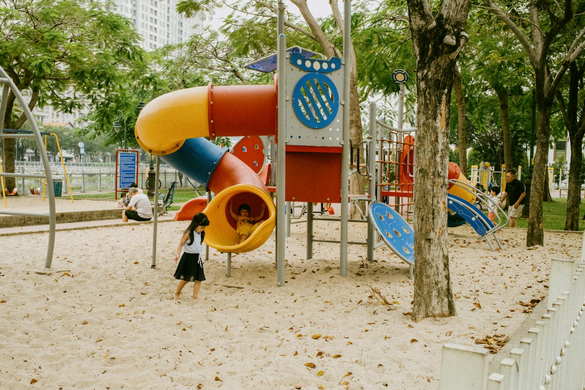 Children playing at a playground in Frisco Texas parks perfect for family vacations