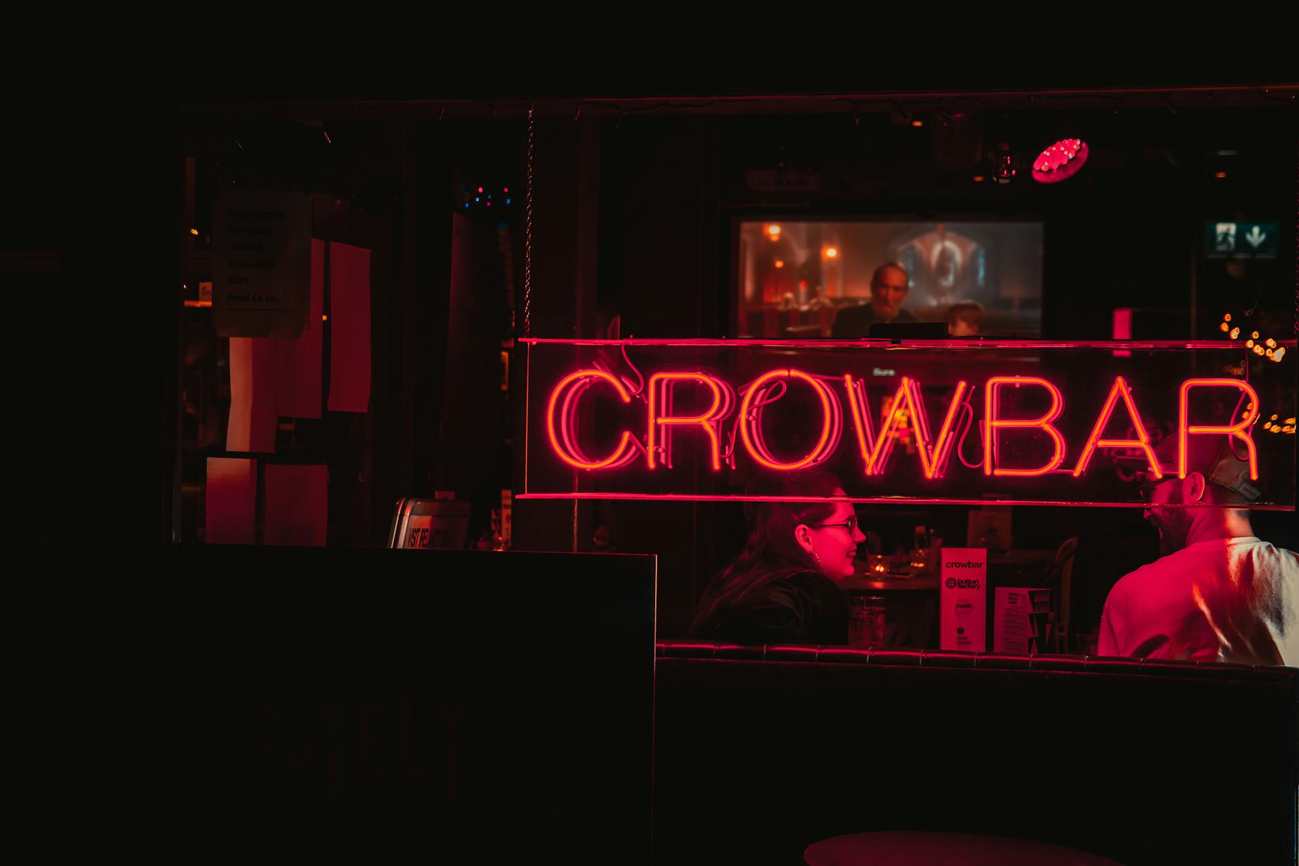 Vibrant bar with neon lights representing Frisco TX nightlife