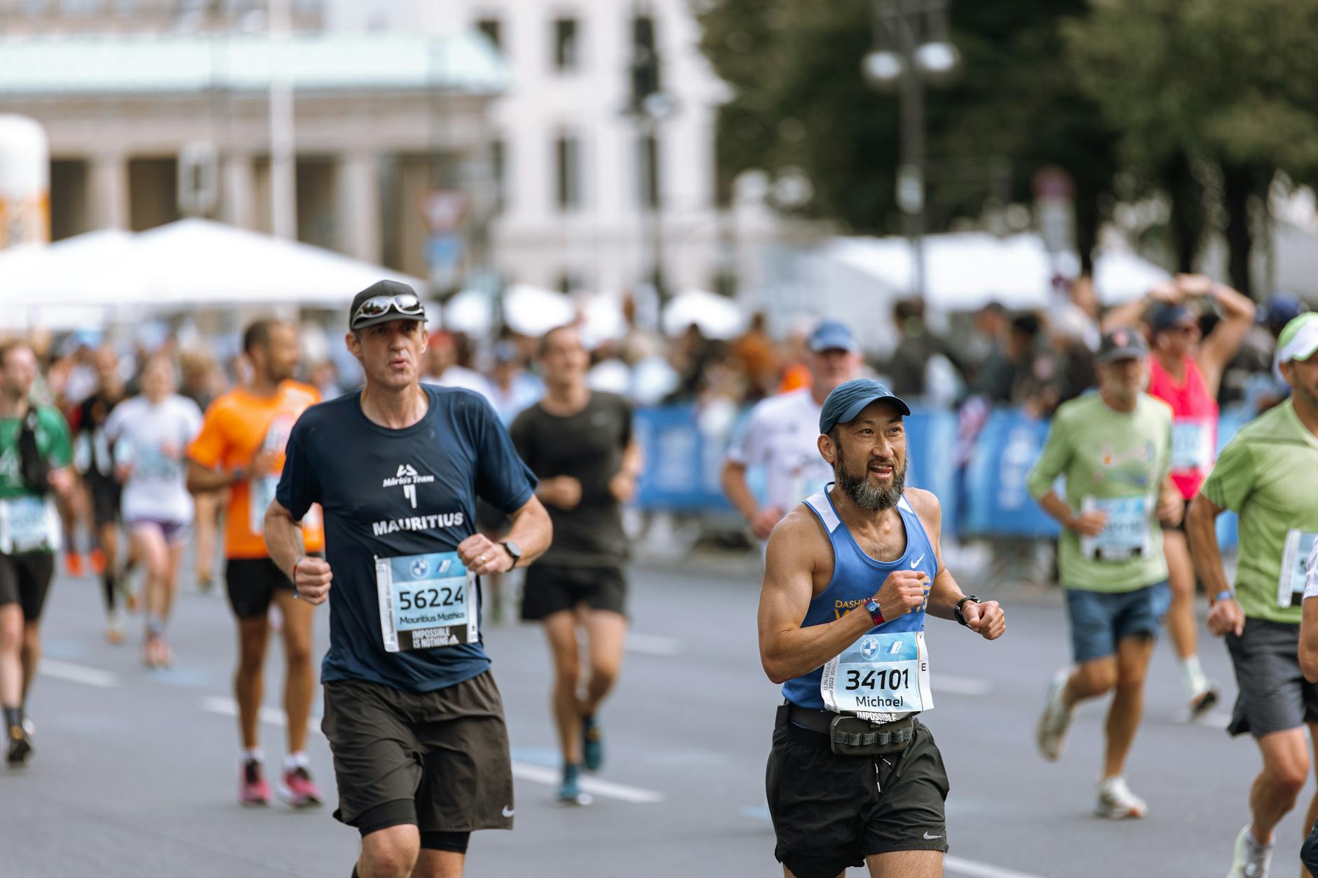 Runners competing in a road race representing Frisco TX sports events and marathons