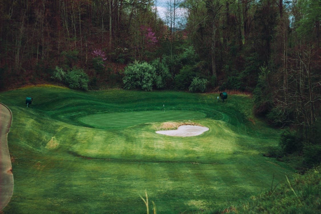 Beautiful championship golf course with lush green fairways similar to PGA Frisco Fields Ranch courses in Frisco Texas
