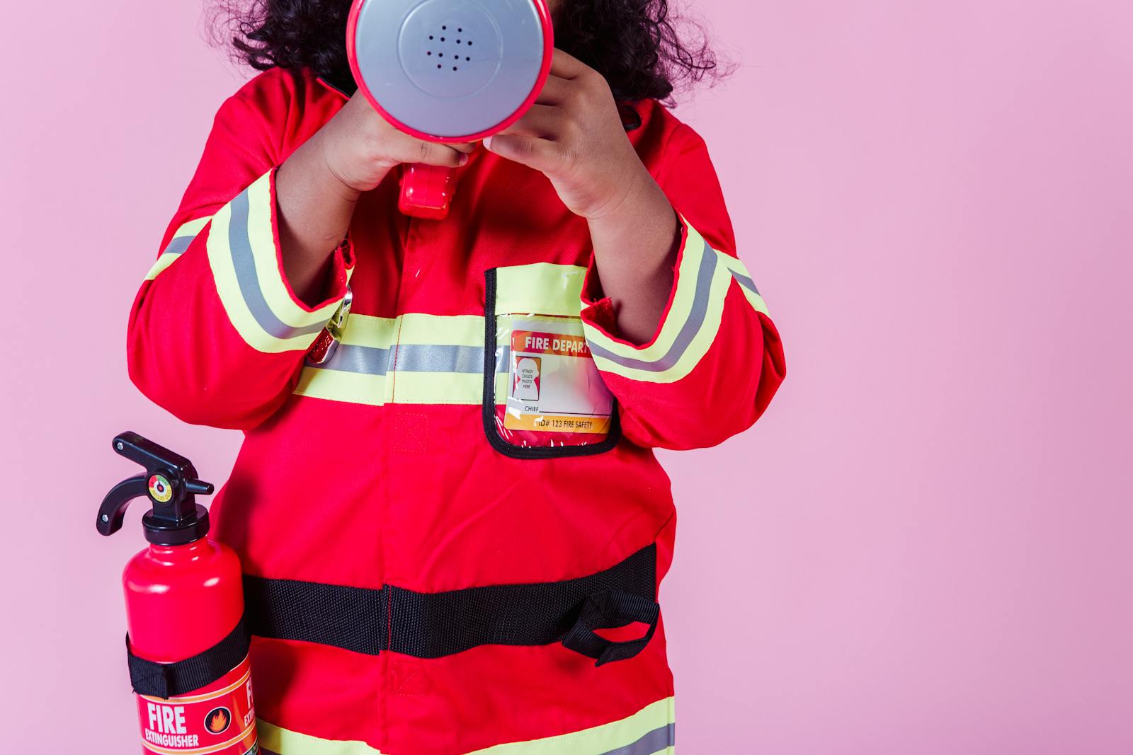 Children dressed as firefighters at KidZania Frisco TX