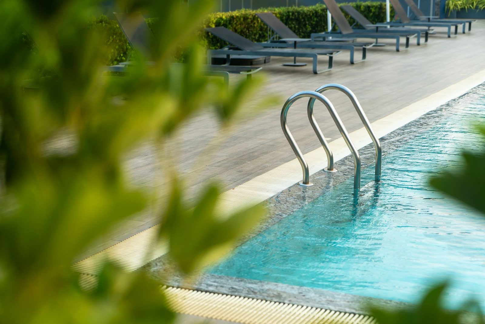 Outdoor pool at an affordable Frisco TX hotel on a summer day