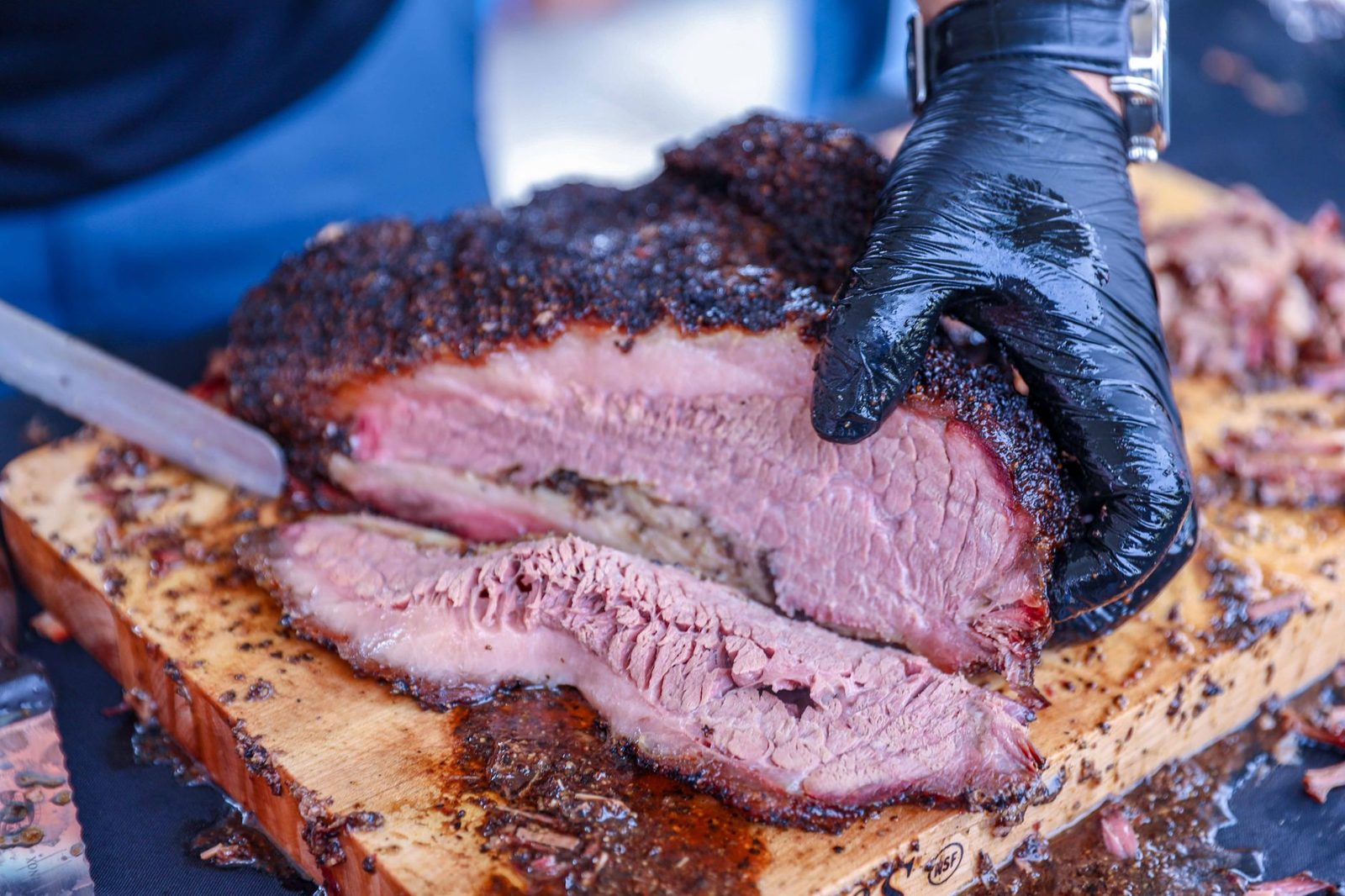 Sliced smoked brisket at a BBQ Frisco TX smokehouse