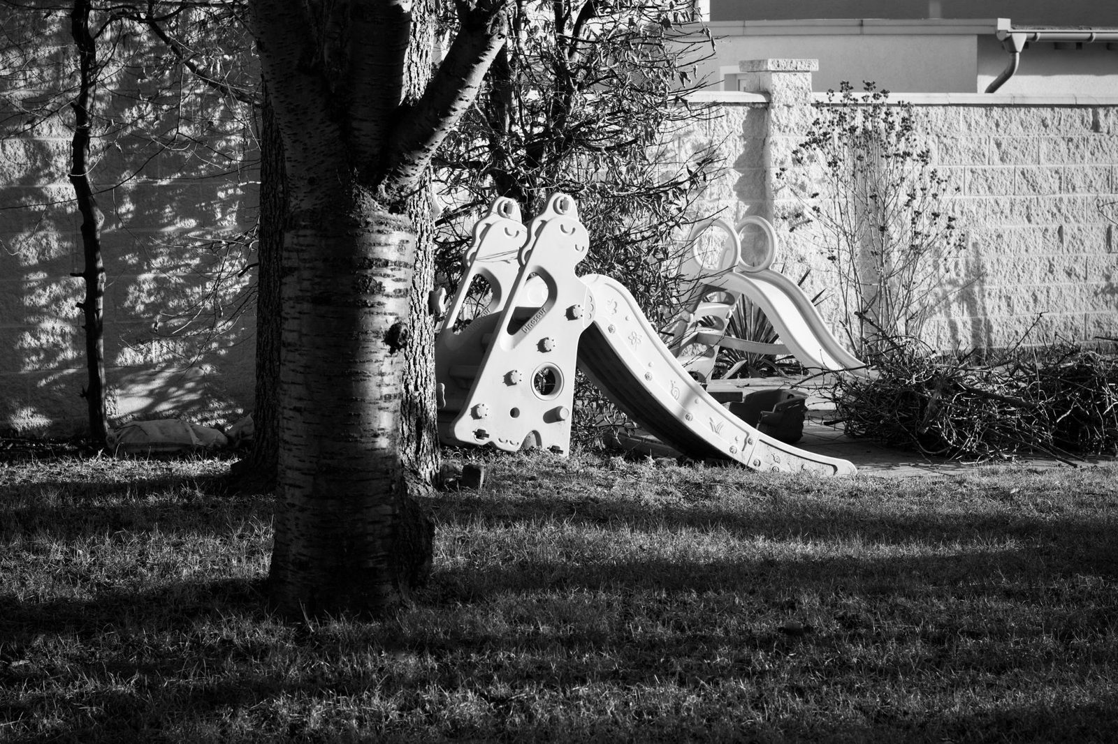 Kids on a colorful slide at one of the best Frisco TX playgrounds