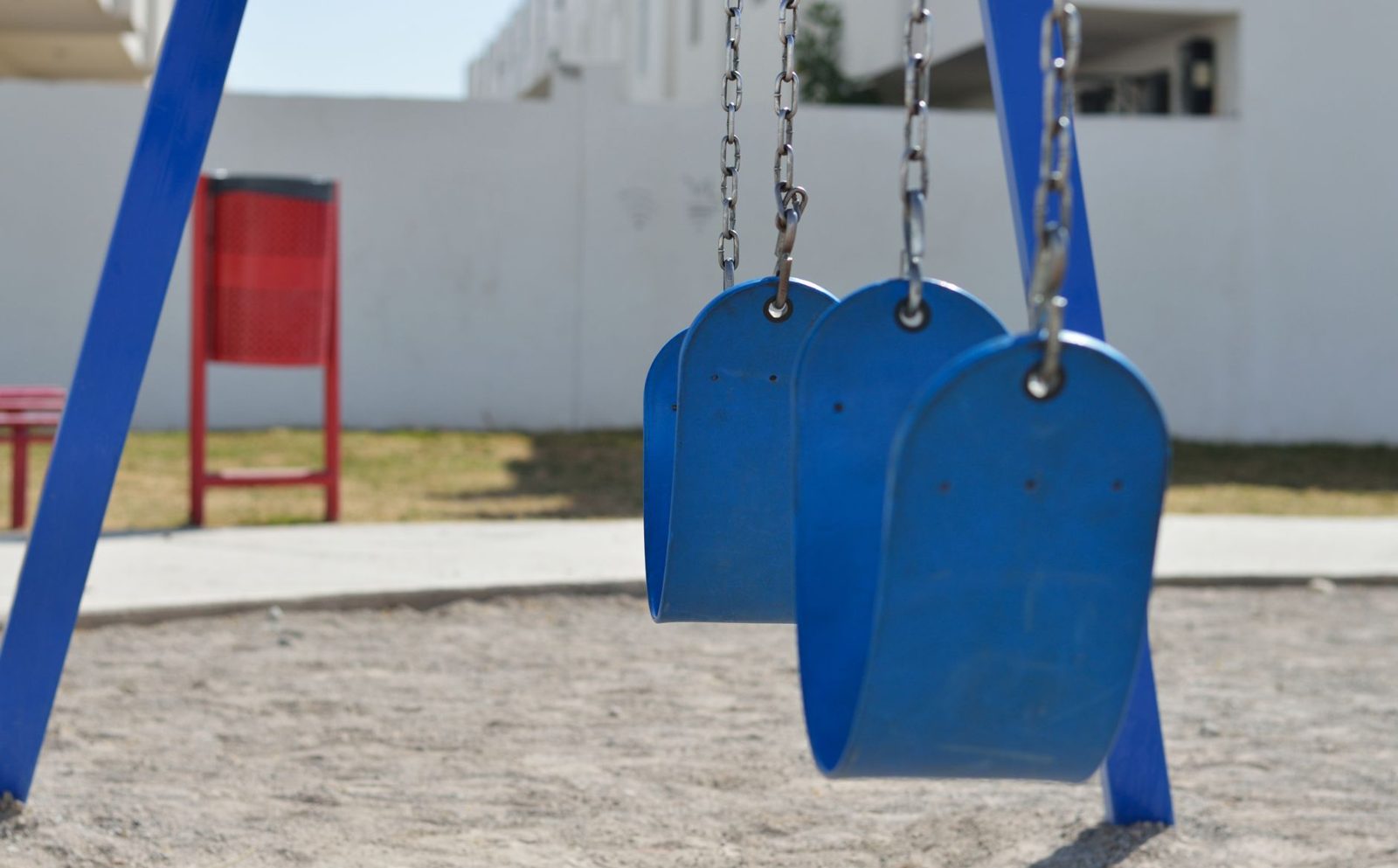 Swings at a family park playground in Frisco Texas