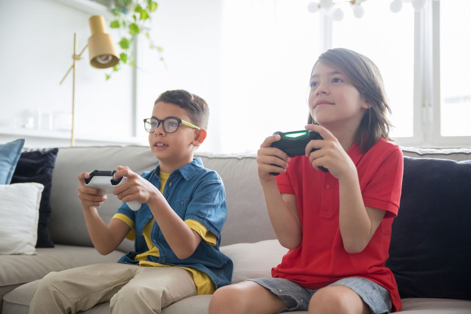 Kids playing classic video games at a family-friendly Frisco attraction