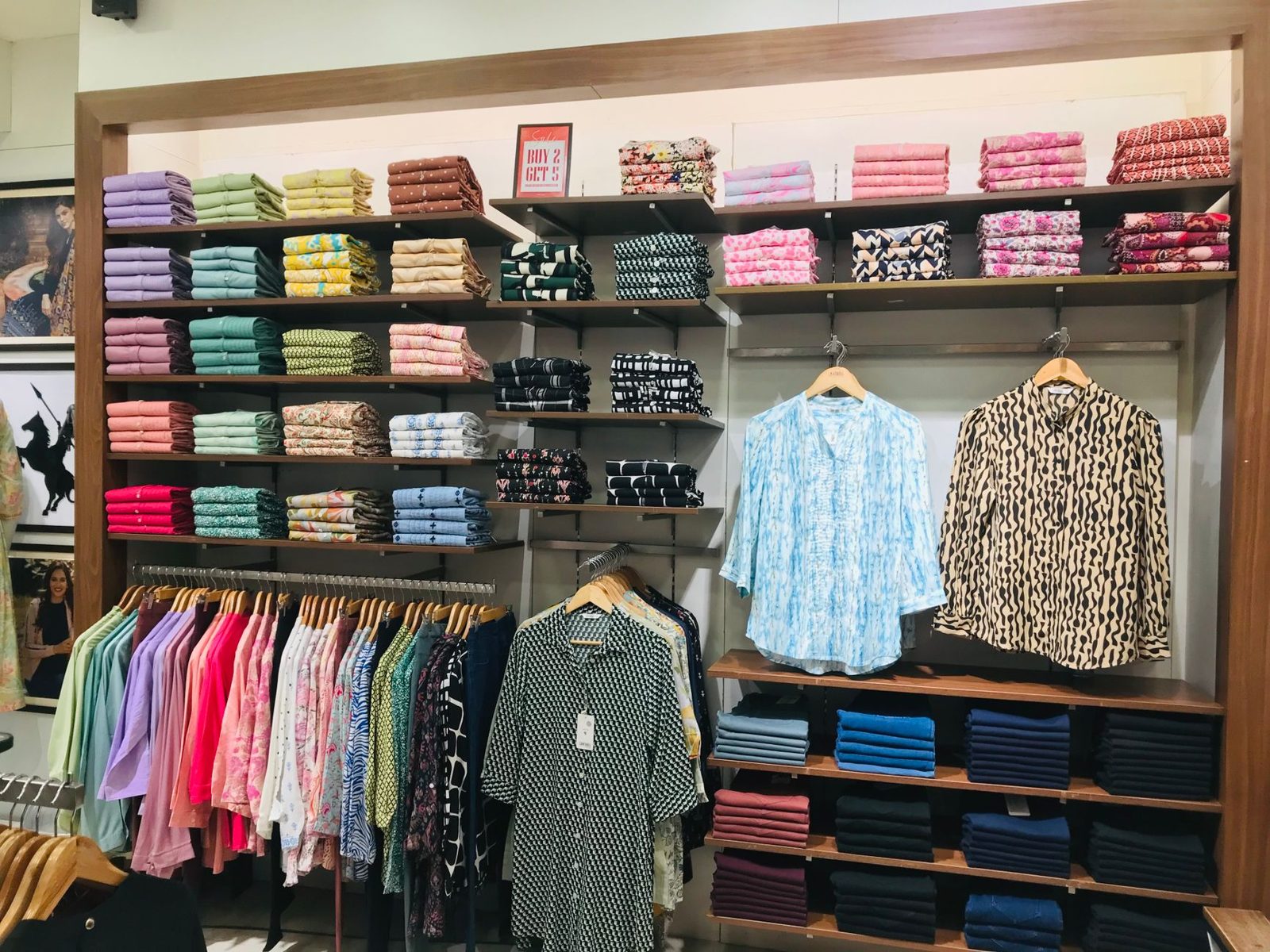 Boutique clothing racks like the local shops along Main Street in the Frisco Rail District