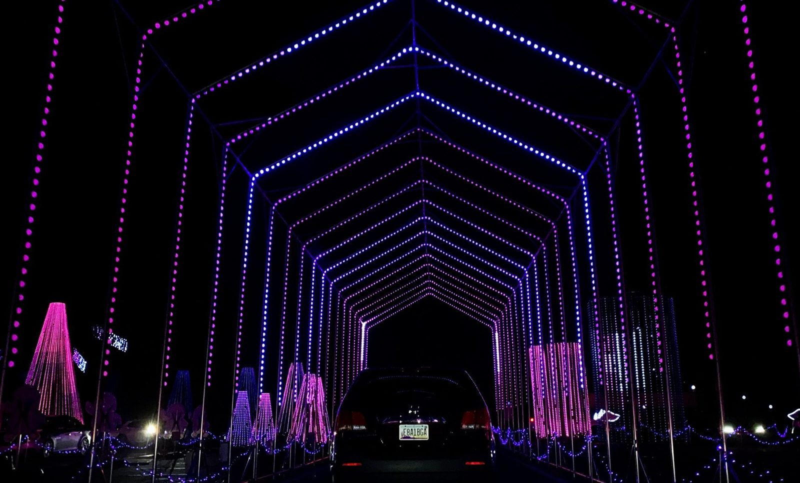 Drive-through holiday light tunnel similar to The Light Park at Riders Field in Frisco Texas