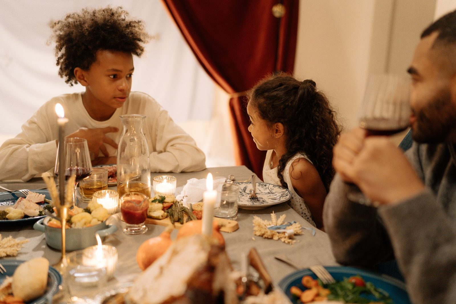Family gathered around a Thanksgiving dinner table, part of Thanksgiving events and traditions in Frisco TX