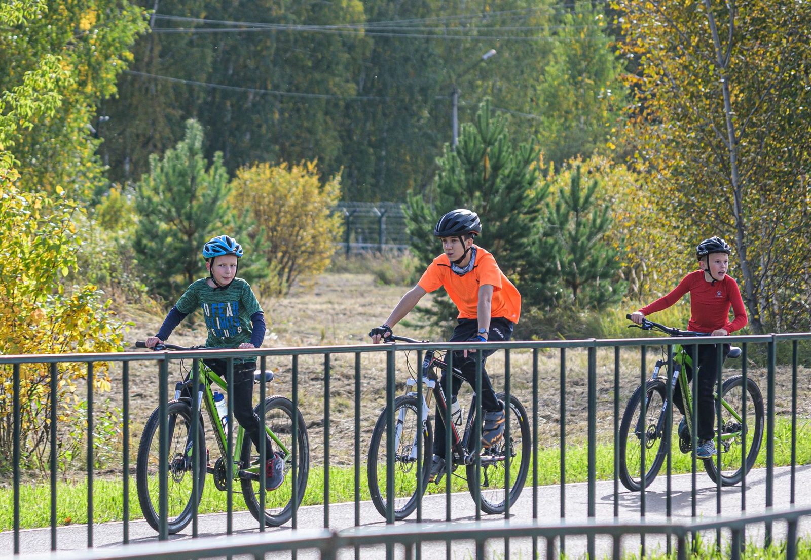 Family riding bikes together on an easy trail, a favorite way to enjoy biking in Frisco TX parks