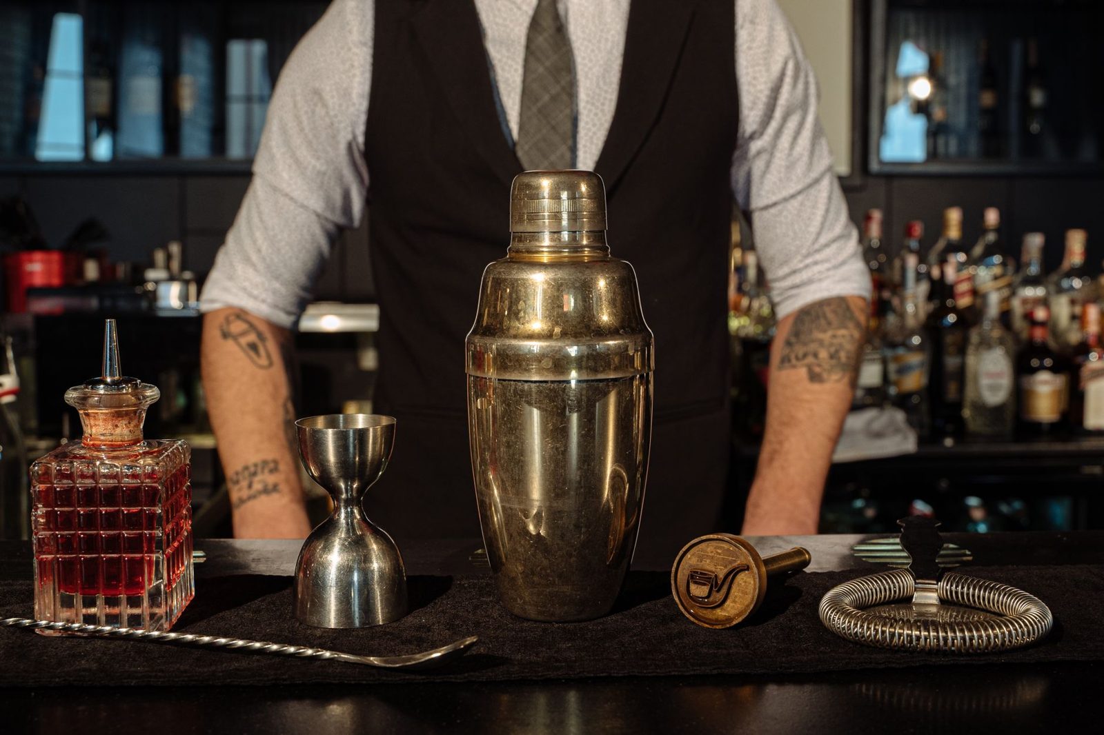 Bartender shaking a signature drink, craft cocktail culture in Frisco Texas lounges