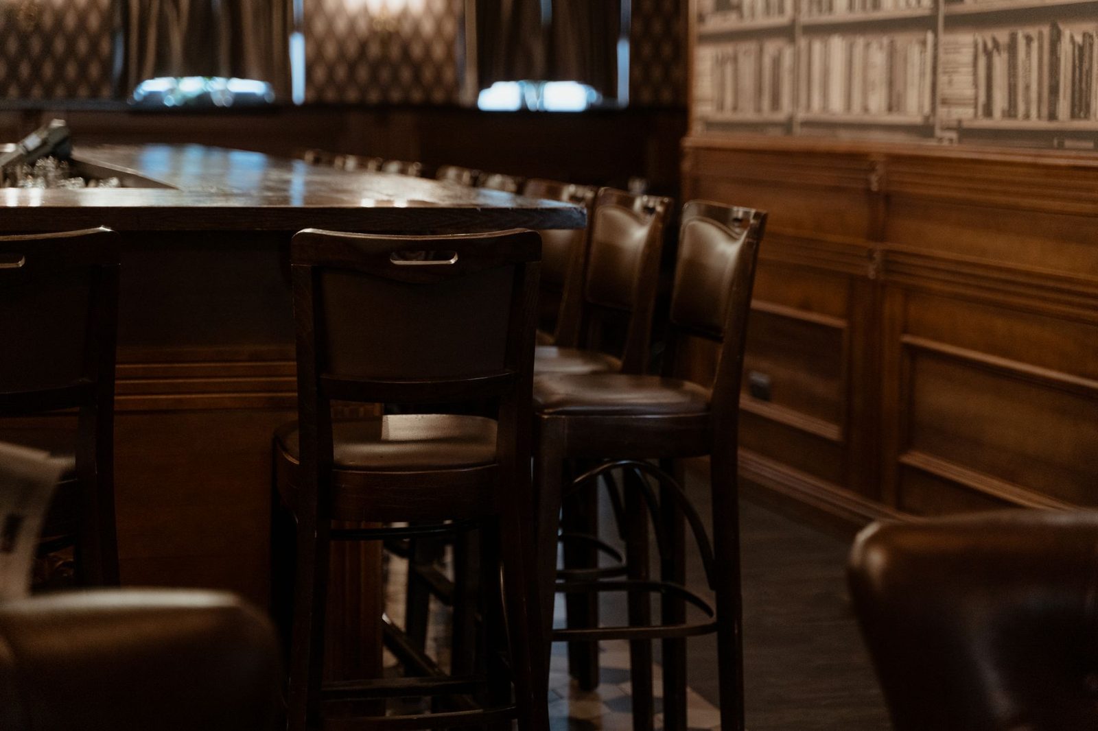 Vintage speakeasy-style bar interior similar to Rare Books Bar, a hidden cocktail lounge in Frisco TX