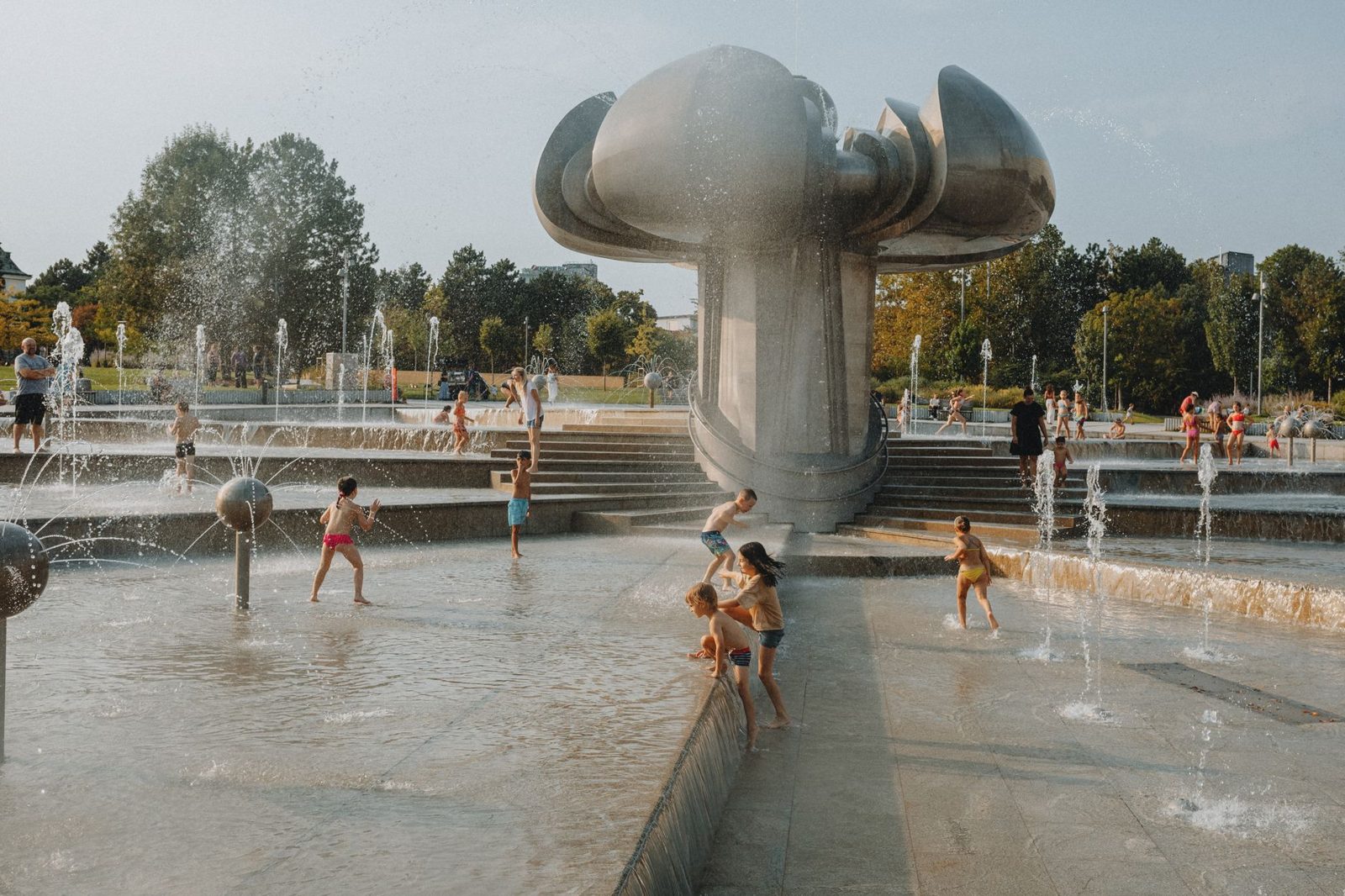 Kids playing at a splash pad on a Frisco TX family vacation