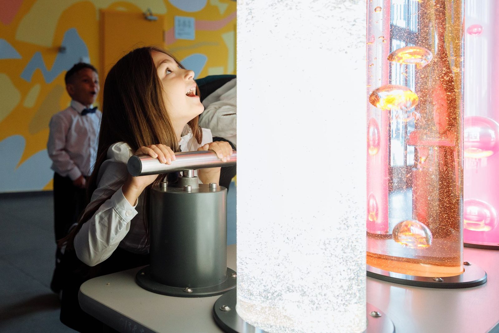 kids exploring a hands-on science exhibit at an indoor kids museum