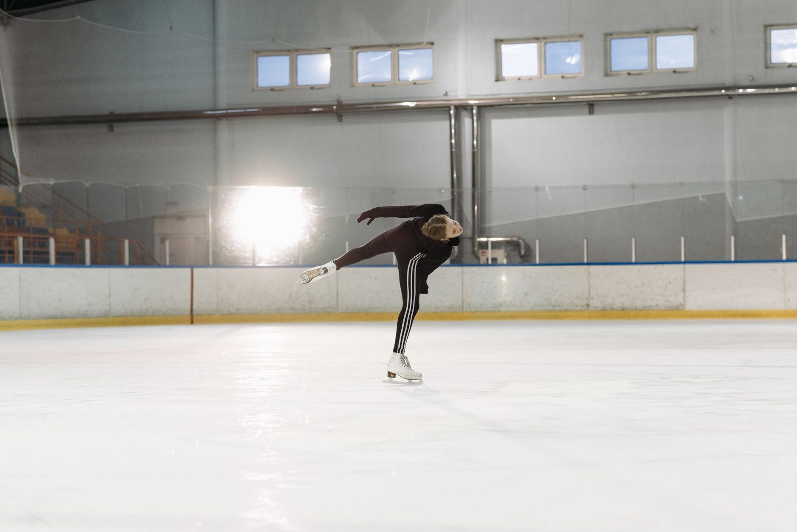 figure skater practicing on the ice, one of the programs offered at the Frisco StarCenter