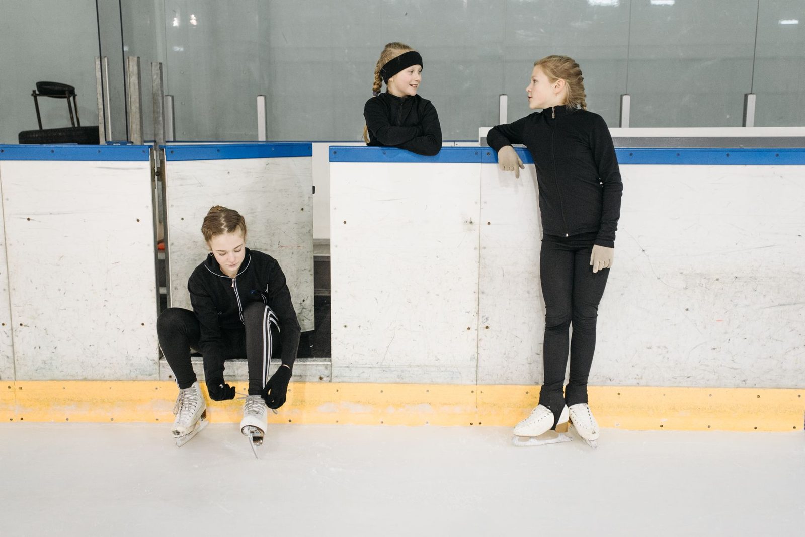 kids learning to ice skate at a public skating session in Frisco TX