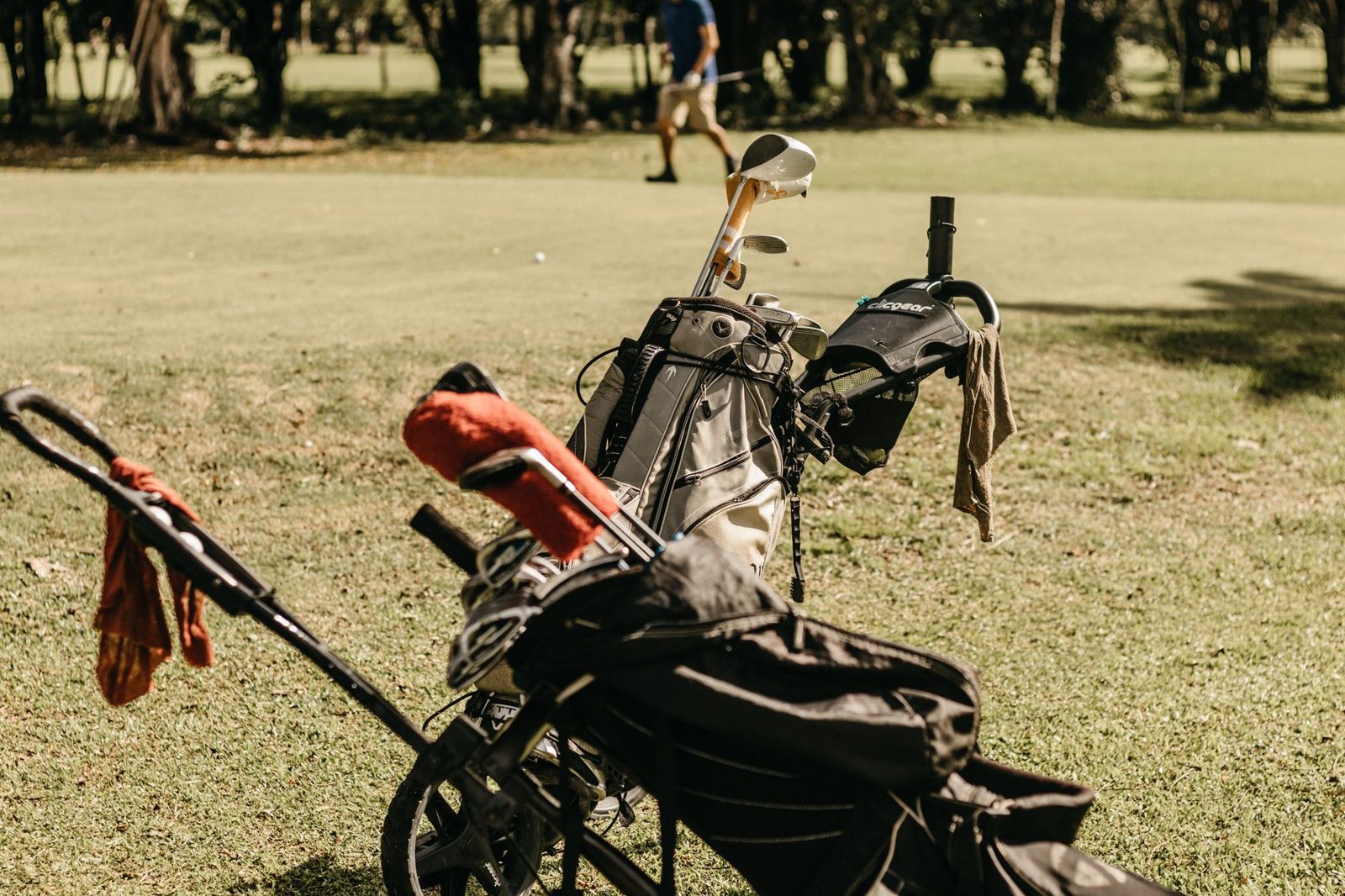 golf clubs and caddie bag for a Fields Ranch tee time at PGA Frisco