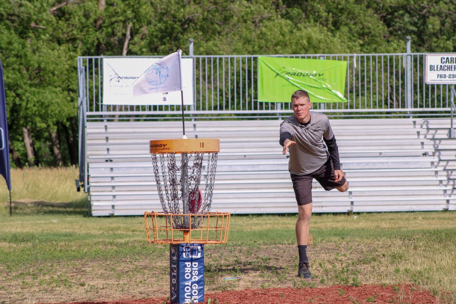 Player driving a disc during a round of disc golf Frisco TX