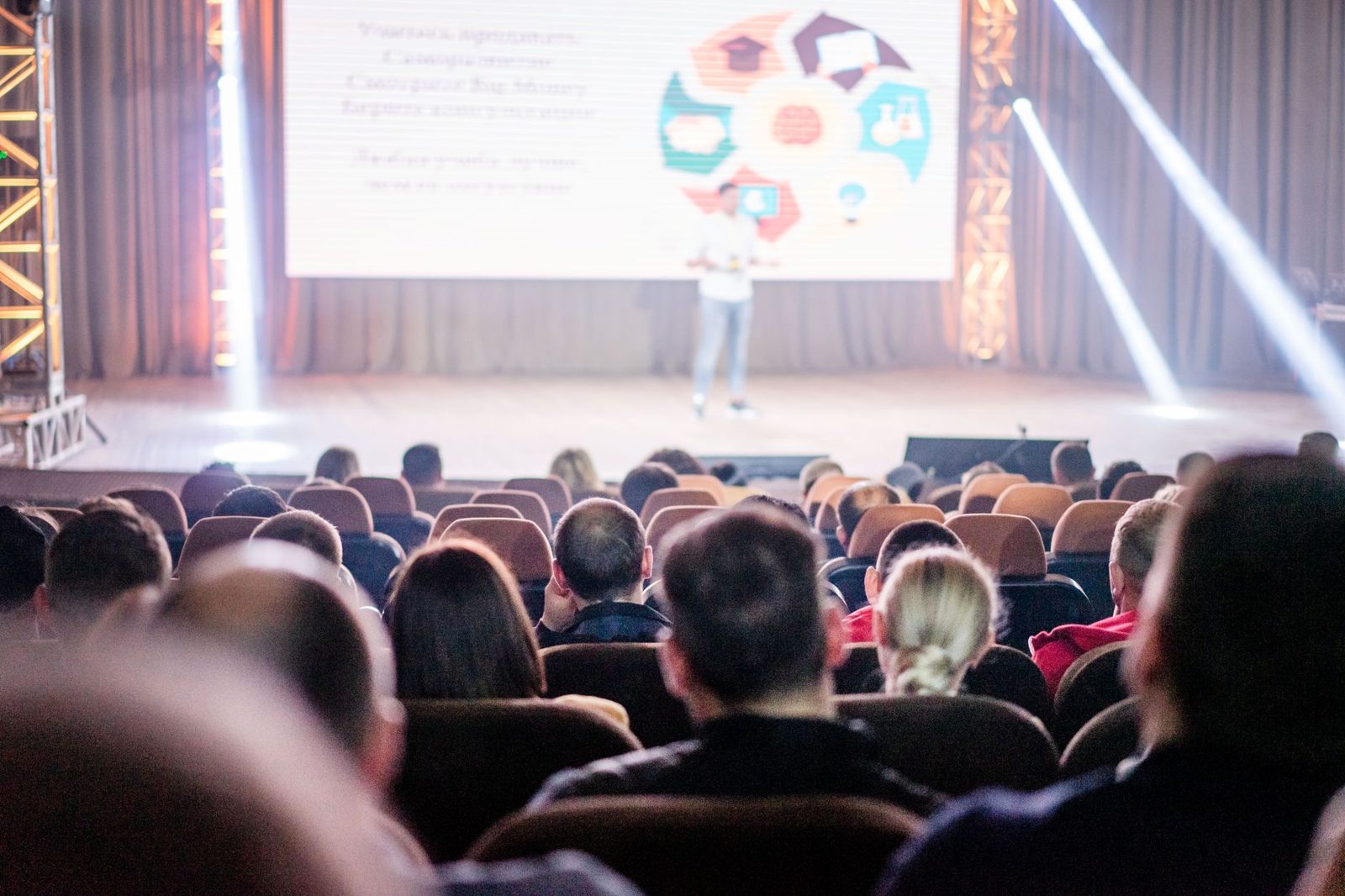 Speaker on stage at a conference held in a Frisco TX event venue