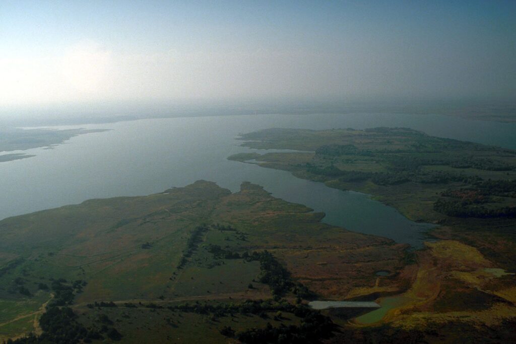 Aerial view of Ray Roberts Lake with its winding arms and wooded shoreline