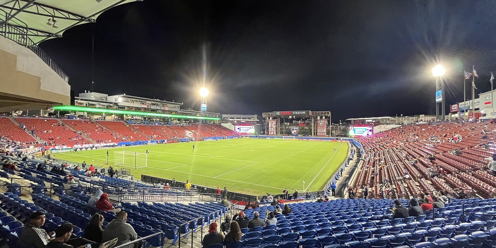 Fans in the stands at a night soccer match at Toyota Stadium, a fixture of Frisco TX spring events