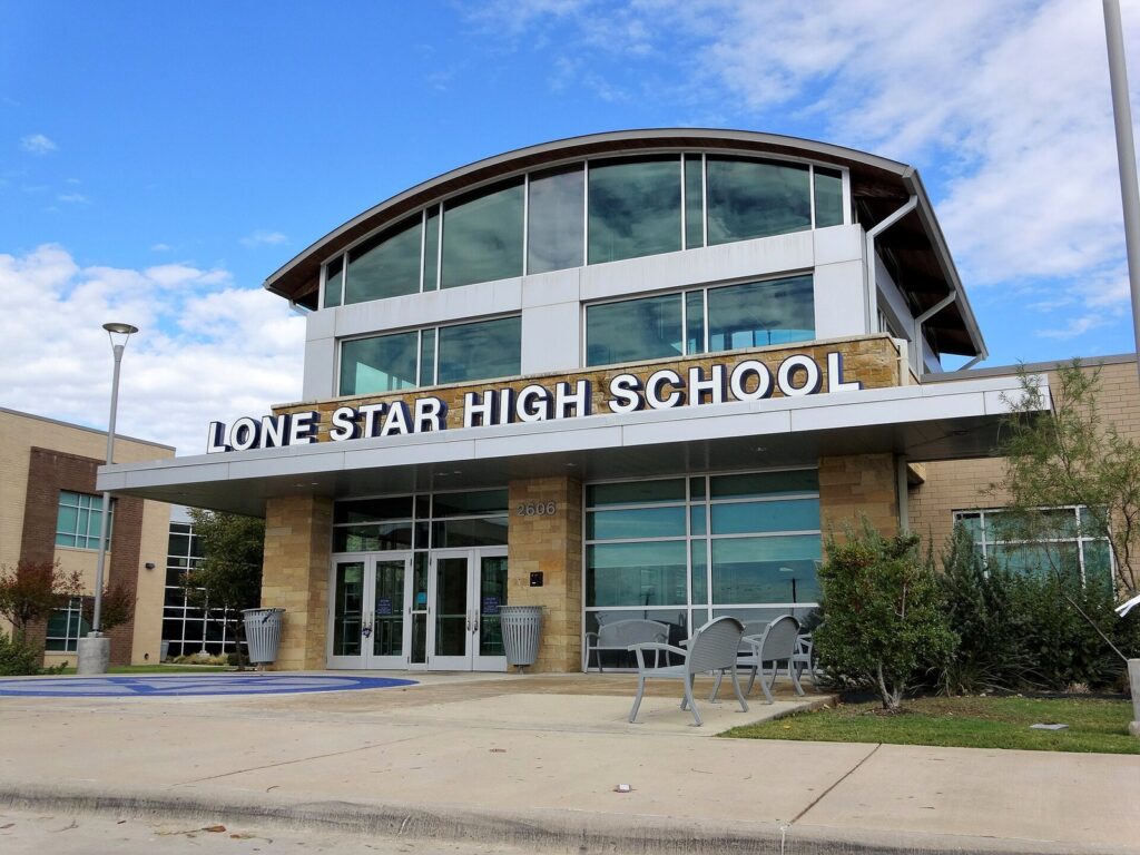 Front entrance of Lone Star High School, a Frisco ISD campus, on a sunny day