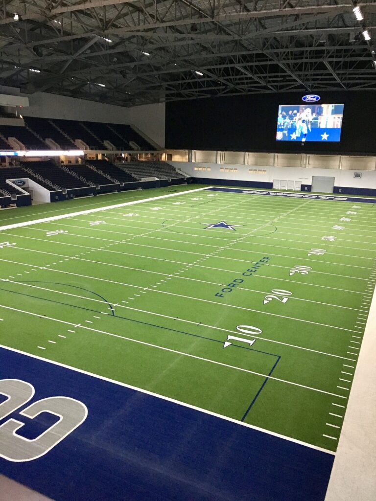 Indoor turf field and stands inside the Ford Center at The Star in Frisco