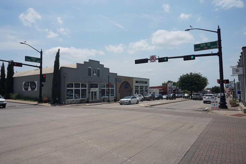 Main Street storefronts and intersection in downtown Frisco, now on a Frisco TX public transportation route