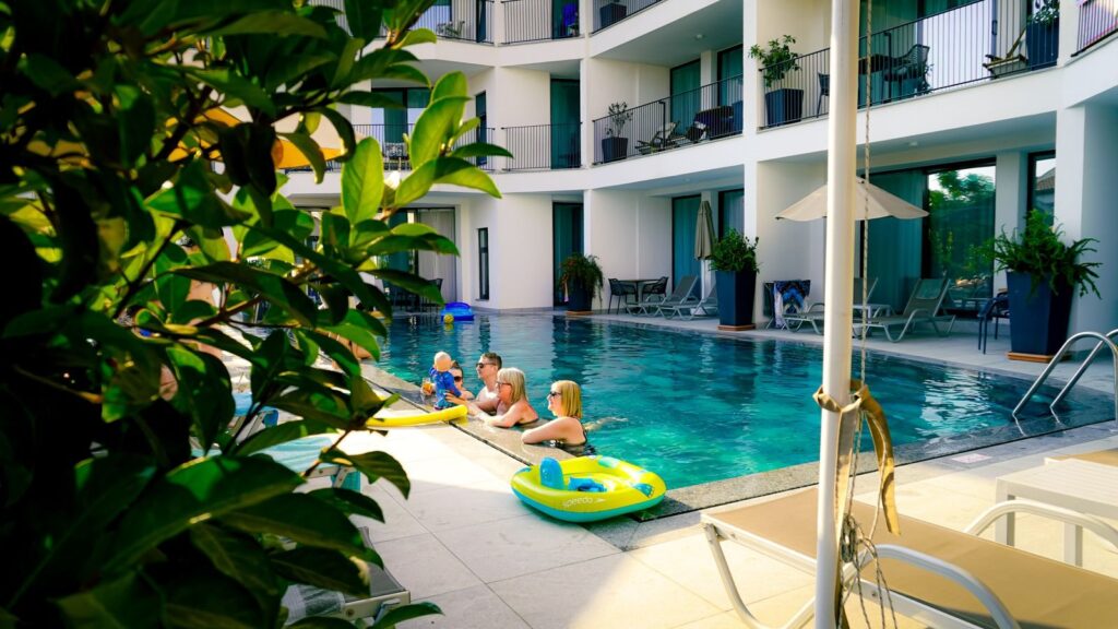 Pool with inflatable toys, the kind family hotels in Frisco TX offer