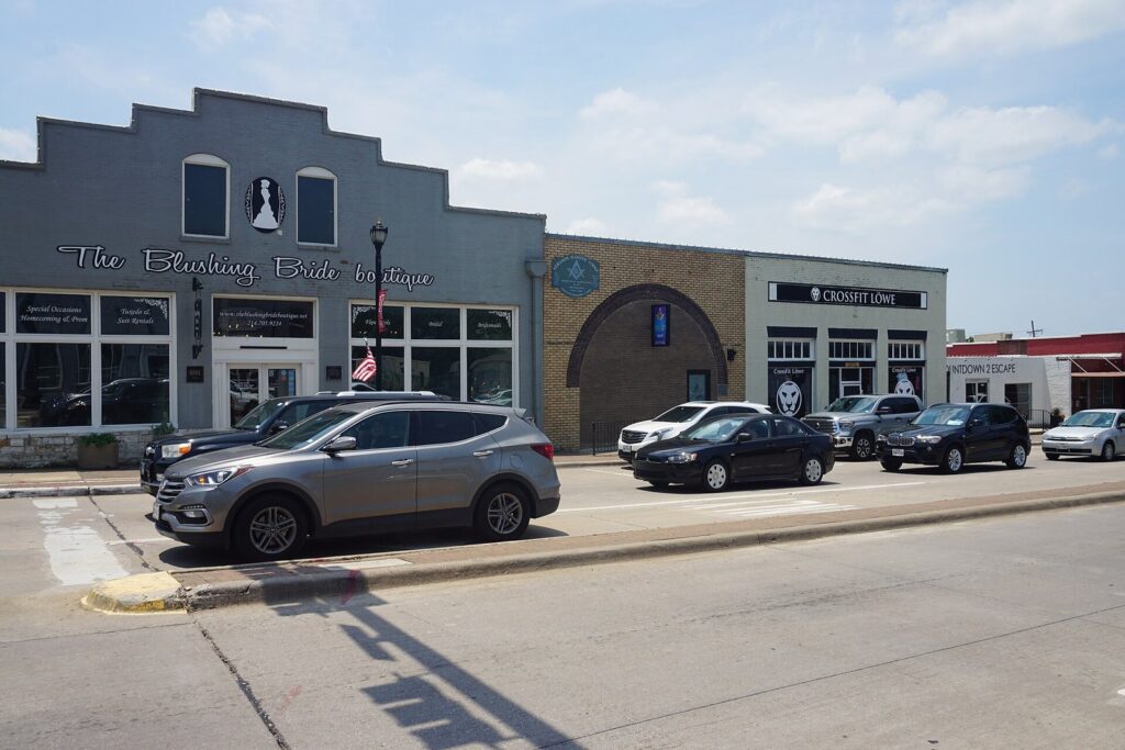 Storefronts and parked cars along historic Main Street in downtown Frisco