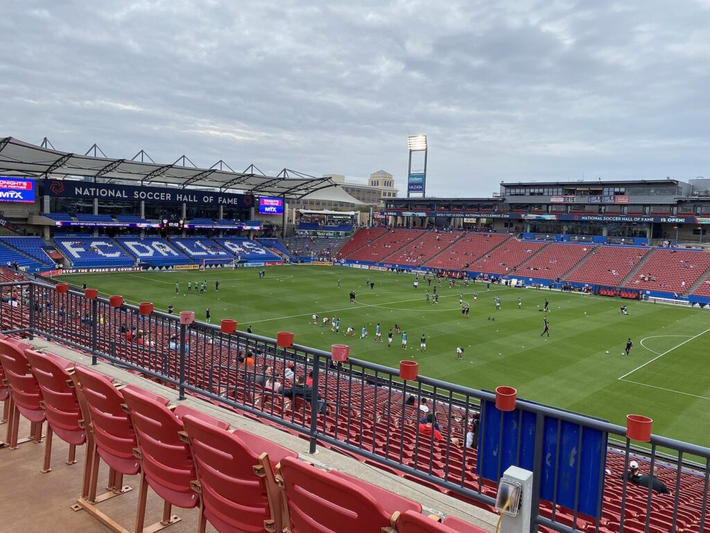 Toyota Stadium's pitch and red seats with the National Soccer Hall of Fame sign