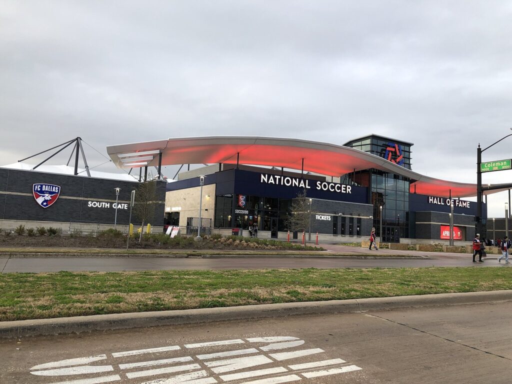 Toyota Stadium's South Gate beside the Hall of Fame building on an overcast day