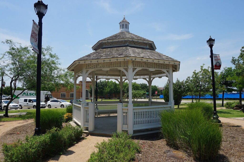 White gazebo on the Frisco Heritage Center grounds, a setting for cultural events in Frisco TX
